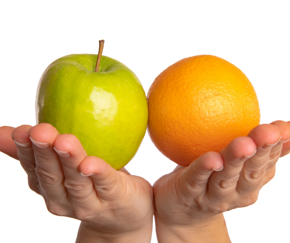 A picture of two hands, with one hand holding an apple and another hand holding an orange. This depicts the fact that a Bible College and Seminary are not the same thing.